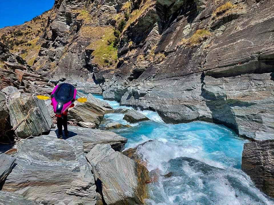 Kayaker on whitewater rapids